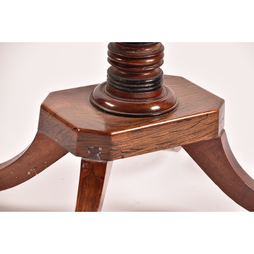 374 - An unusual Regency mahogany and elm foldover card table, the rosewood crossbanded top opening to rev... 