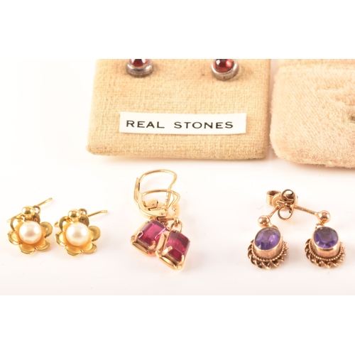 41 - A collection of 9ct yellow gold earrings, set with various gemstones, together with an array of yell... 