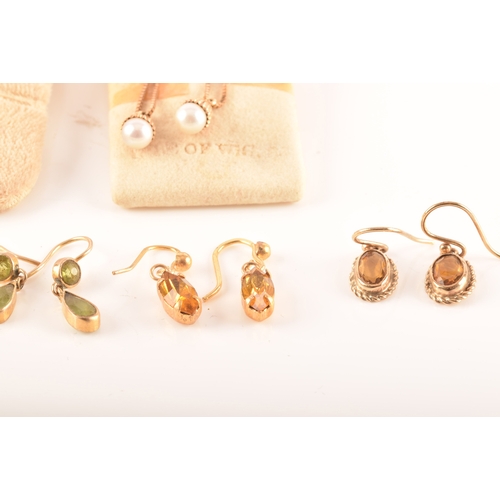 41 - A collection of 9ct yellow gold earrings, set with various gemstones, together with an array of yell... 