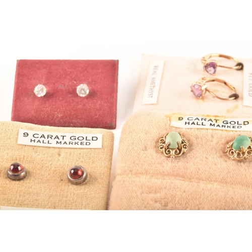 41 - A collection of 9ct yellow gold earrings, set with various gemstones, together with an array of yell... 