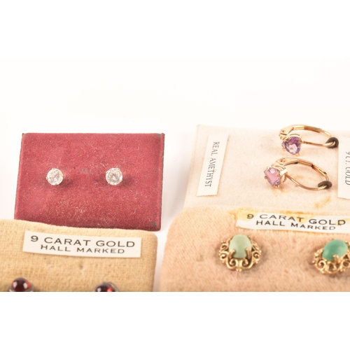 41 - A collection of 9ct yellow gold earrings, set with various gemstones, together with an array of yell... 