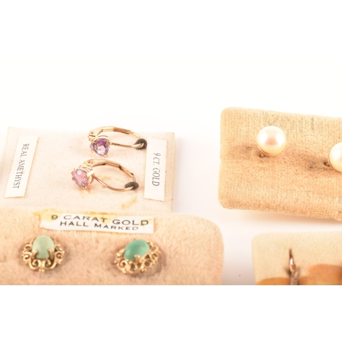 41 - A collection of 9ct yellow gold earrings, set with various gemstones, together with an array of yell... 