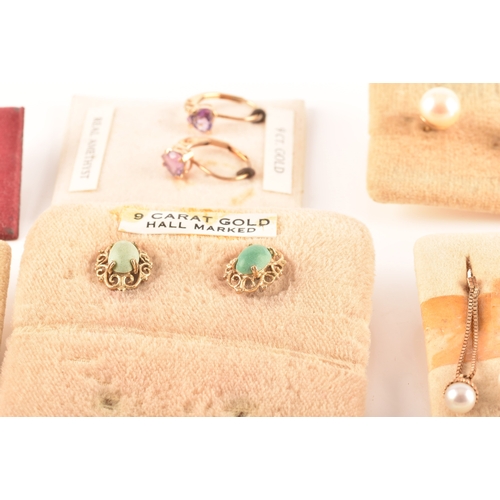 41 - A collection of 9ct yellow gold earrings, set with various gemstones, together with an array of yell... 