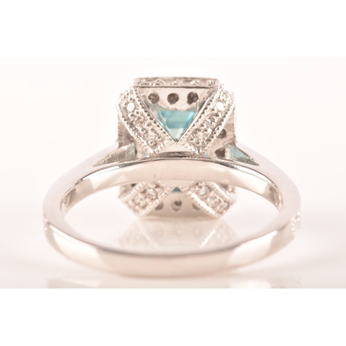 44 - An 18ct white gold aquamarine and diamond dress ring, set to centre with a rectangular aquamarine wi... 