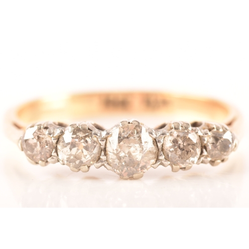 59 - A Victorian 18ct gold and diamond five stone ring, set with five graduating round old cut diamonds, ... 