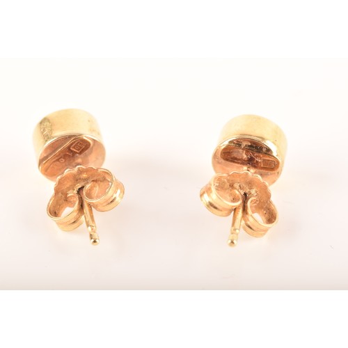 60 - A 9ct gold leaping leopard brooch, together with a pair of 18ct gold stud earrings. (2)