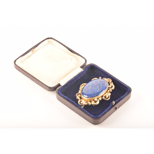 50 - A Victorian mourning brooch, set with a large cabochon lapis lazuli, engraved 'Madeleine born June 1... 