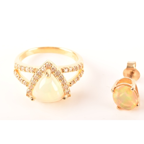 107 - A 9ct yellow gold stud earrings, each set with a oval opal, together with a 9ct yellow gold pendant ... 