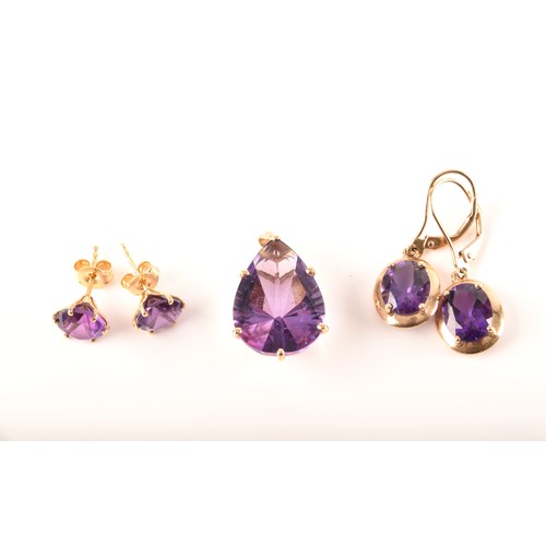 89 - A 9ct yellow gold pendant set with a large pear cut amethyst, together with a pair of 9ct yellow gol... 