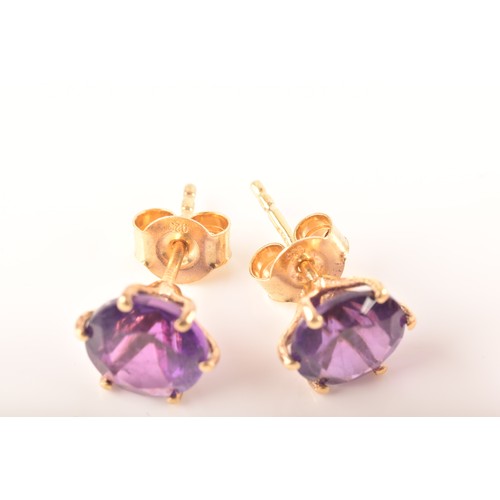 89 - A 9ct yellow gold pendant set with a large pear cut amethyst, together with a pair of 9ct yellow gol... 