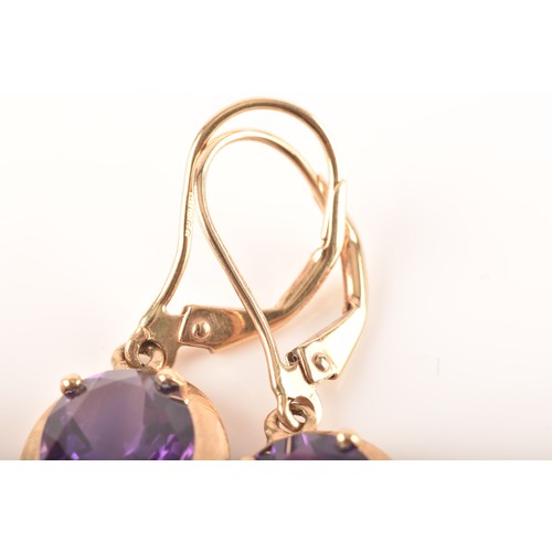 89 - A 9ct yellow gold pendant set with a large pear cut amethyst, together with a pair of 9ct yellow gol... 