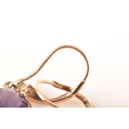 89 - A 9ct yellow gold pendant set with a large pear cut amethyst, together with a pair of 9ct yellow gol... 