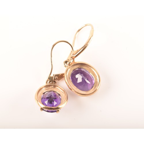 89 - A 9ct yellow gold pendant set with a large pear cut amethyst, together with a pair of 9ct yellow gol... 