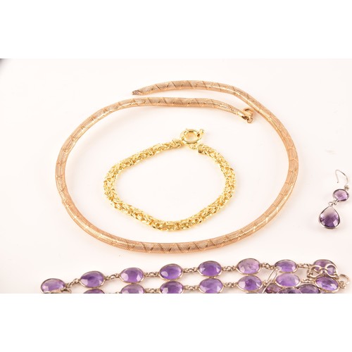 61 - A 9ct gold spring necklace, together with several beaded necklaces including a triple row purple, gr... 