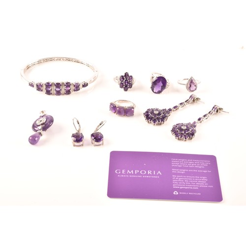 108 - A large collection of silver amethyst jewellery, including a large solitaire dress ring, a floral cl... 