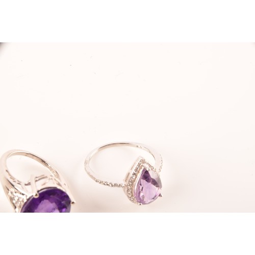 108 - A large collection of silver amethyst jewellery, including a large solitaire dress ring, a floral cl... 