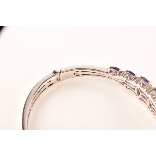 108 - A large collection of silver amethyst jewellery, including a large solitaire dress ring, a floral cl... 