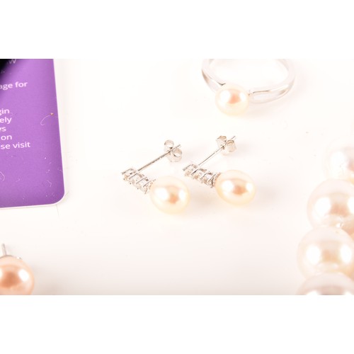 105 - A collection of cultured pearl jewellery, including two large pearl necklaces with magnetic fittings... 