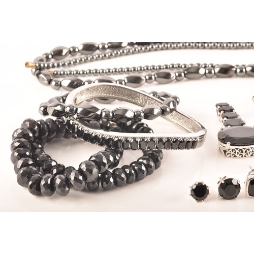 106 - A large collection of silver boi ploi black spinel jewellery, including nine rings, six pairs of ear... 