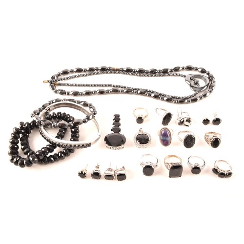 106 - A large collection of silver boi ploi black spinel jewellery, including nine rings, six pairs of ear... 