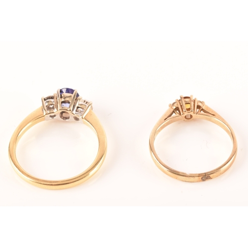 48 - An 18ct yellow gold sapphire and diamond three stone ring, set to centre with a oval cut sapphire wi... 