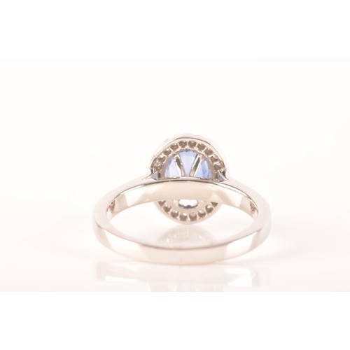 49 - An 18ct white gold sapphire and diamond oval cluster, set to centre with a oval cut blue sapphire wi... 