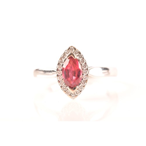 64 - A 18ct white gold ruby and diamond ring, set to centre with a marquise shape ruby with an approximat... 