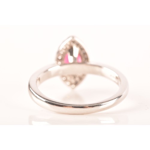 64 - A 18ct white gold ruby and diamond ring, set to centre with a marquise shape ruby with an approximat... 