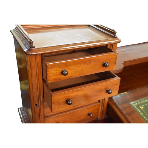 383 - A Victorian mahogany clarks pedestal desk, the top with central raising writing slope containing a f... 