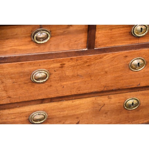 384 - A 19th century continental marble top mahogany commode with three frieze drawers over two long drawe... 