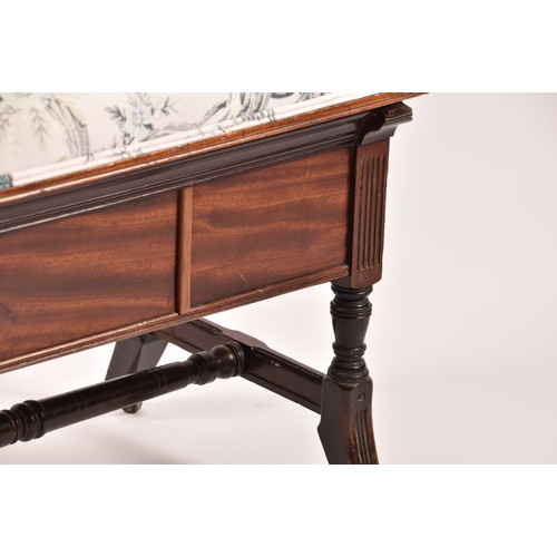 388 - An Edwardian mahogany duet piano stool, with hinged lid, upholstered in peacock fabric, with turned ... 