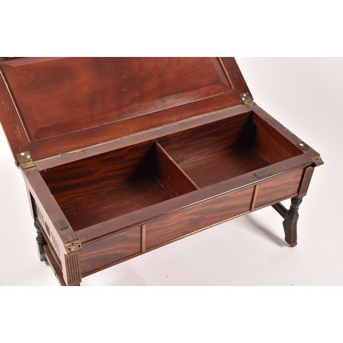 388 - An Edwardian mahogany duet piano stool, with hinged lid, upholstered in peacock fabric, with turned ... 