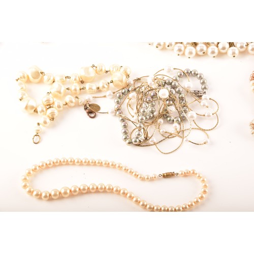 54 - A large quantity of cultured pearl jewellery including many necklaces, chokers, bracelets, loose pea... 