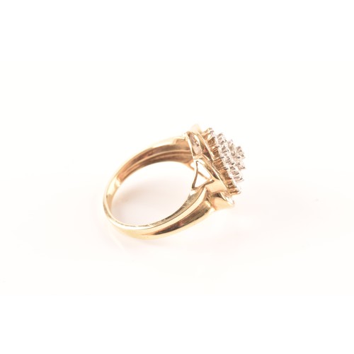 55 - A 9ct yellow gold diamond flower cluster ring, featuring a myriad of brilliant cut diamonds, further... 