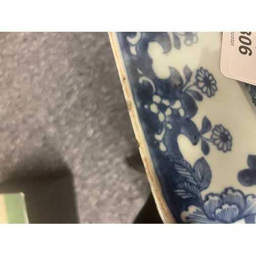 306 - A 19th century Chinese blue and white porcelain meat platter, decorated with a landscape scene of ba... 