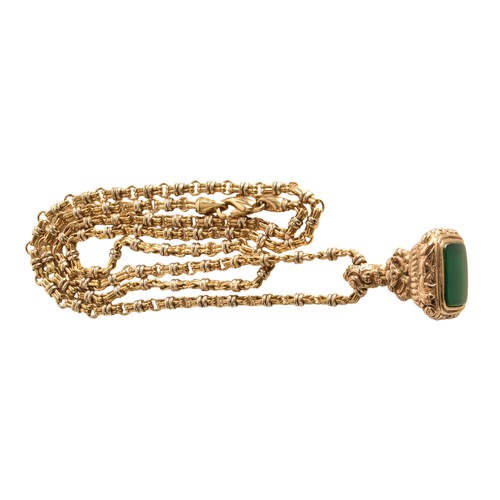A antique ornate yellow gold chrysophase watch fob, on a 18ct yellow and white gold chain, 70 cm long, fob is accompanied by two past valuations.  