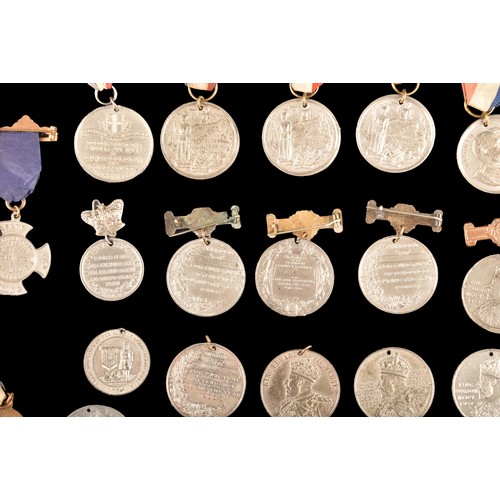 208 - A large collection of attendance medals including The King's Medal Attendance awards for London Coun... 