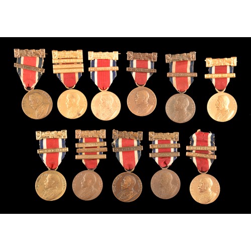 208 - A large collection of attendance medals including The King's Medal Attendance awards for London Coun... 