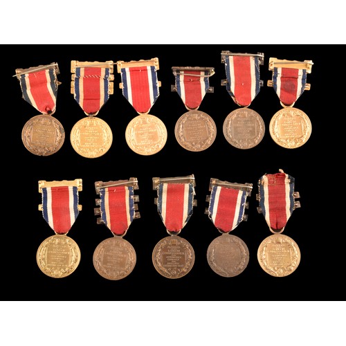 208 - A large collection of attendance medals including The King's Medal Attendance awards for London Coun... 