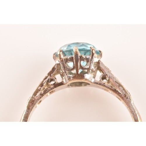 15 - An 9ct yellow gold and white metal solitaire ring, set to centre with a round cut zircon with an app... 