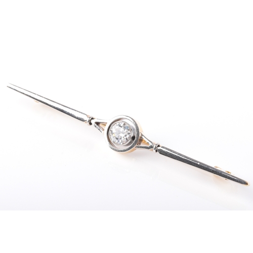 29 - A yellow and white gold and diamond bar brooch, set to centre with a round brilliant cut diamond wit... 