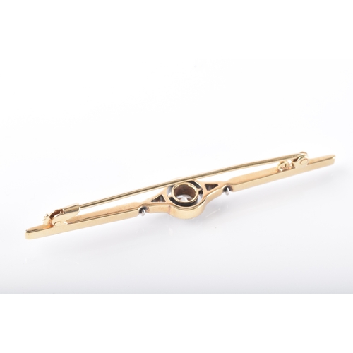 29 - A yellow and white gold and diamond bar brooch, set to centre with a round brilliant cut diamond wit... 
