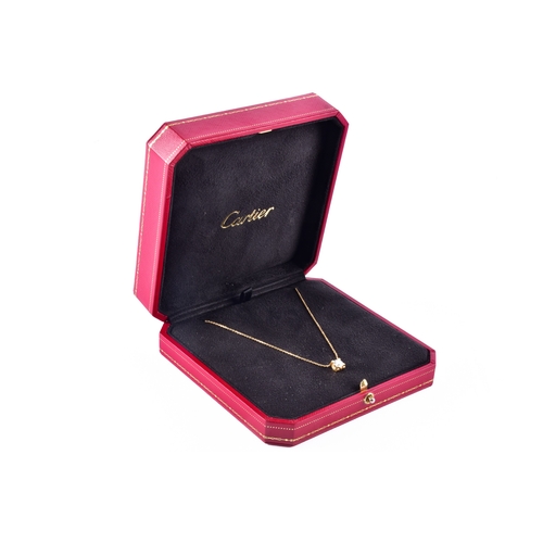 Cartier. A C De Cartier 18ct yellow gold diamond pendant, featuring a round brilliant cut diamond with a weight of 0.58 carats, D colour, VVS1 clarity, in original presentation box, accompanied by GIA Certificate no.1136762367, and certificate of authenticity. Serial no. TUG57G.