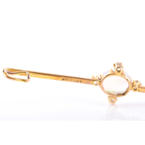 65 - A 9ct yellow gold opal and diamond brooch, set with an oval cabochon opal measuring approximately 8.... 