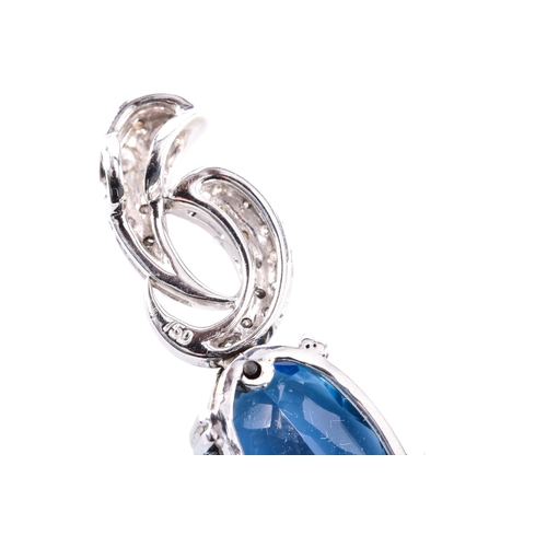 51 - A white gold aquamarine and diamond pendant