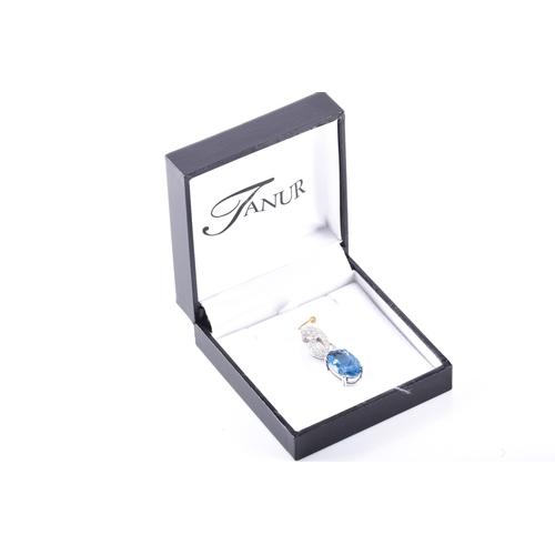 51 - A white gold aquamarine and diamond pendant
