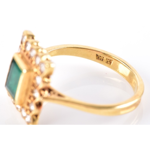 37 - An emerald and diamond cluster ring, set to the centre with step cut emerald with an approximate wei... 