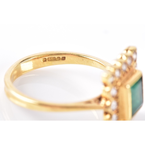 37 - An emerald and diamond cluster ring, set to the centre with step cut emerald with an approximate wei... 