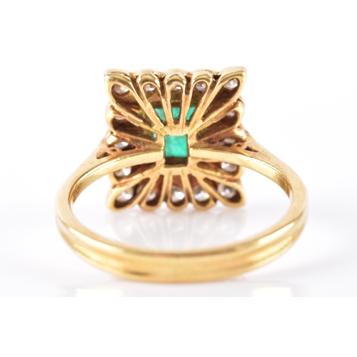 37 - An emerald and diamond cluster ring, set to the centre with step cut emerald with an approximate wei... 
