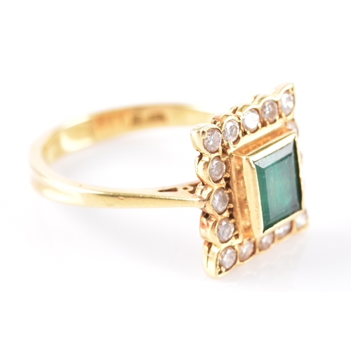 37 - An emerald and diamond cluster ring, set to the centre with step cut emerald with an approximate wei... 